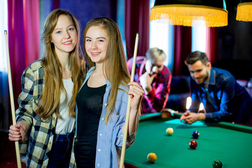 friends playing billiard