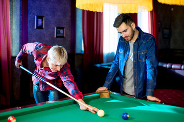 Fototapeta premium two men playing billiard