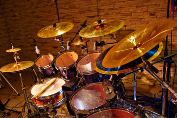 Fototapeta na wymiar drum set with two wooden drumsticks on it