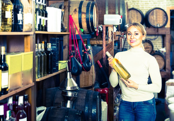 Positive young woman shopping wine
