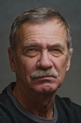 Closeup of a stern old man.