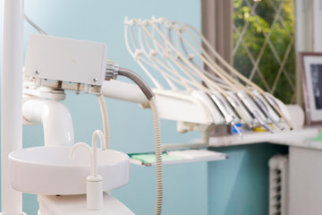 Stomatological instrument in the dentists clinic. Operation, tooth replacement.