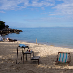 Fototapeta na wymiar Campsite on beach of remote tropical island