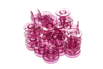 pink plastic bobbin for sewing machine