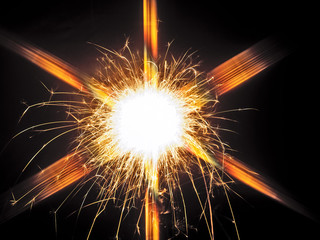 round firework with golden rays and willowy trails
