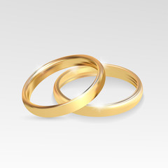 Wedding rings set of gold metal on gray background
