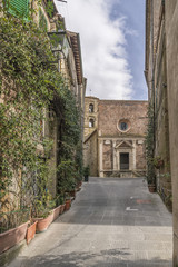 The facade of the ancient Church of Santa Maria e San Rocco in the historic center of Pitigliano, Grosseto, Tuscany, Italy
