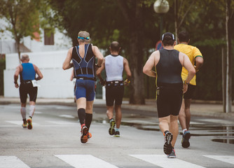 Group of marathon runners on the street.