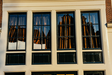 Fototapeta na wymiar Facade of a building with windows. Charming town in Germany . Li