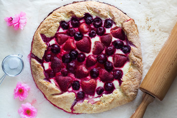Berry Tart. Galette with summer berries. Pie with strawberry and cherry