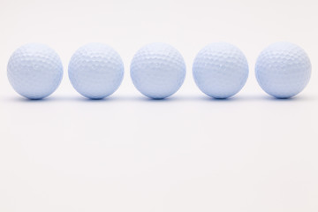 White golf balls on the white background.