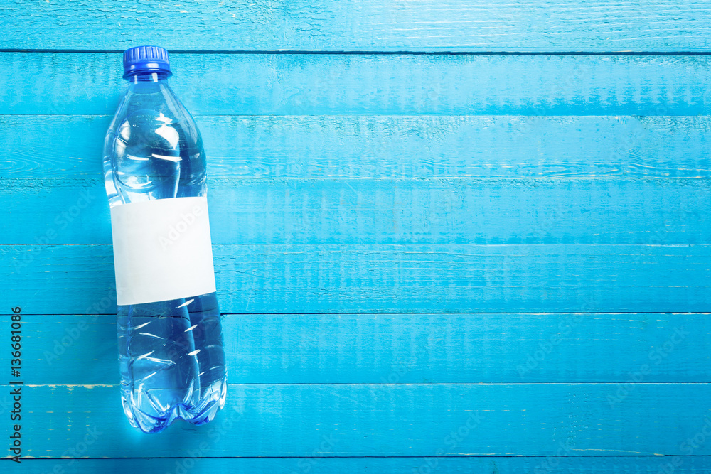 Wall mural water bottle on the wooden table