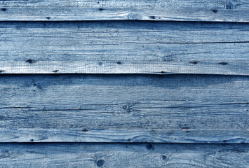 Blue toned wooden wall surface.