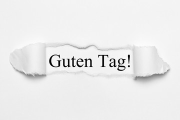 Fototapeta premium Guten Tag! auf weißen gerissenen Papier