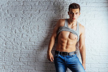 Portrait of a man with nude torso fitness standing