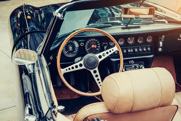 Luxury car interior. Beautiful retro style transport exhibition.
