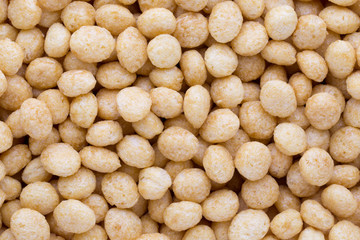 Corn flakes rings on the background.