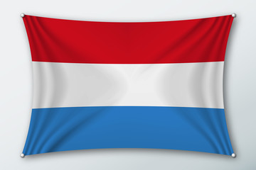 Luxembourg national flag. Symbol of the country on a stretched fabric with waves attached with pins. Realistic vector illustration.