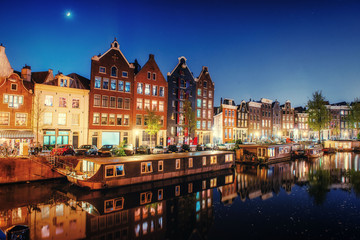Fototapeta na wymiar Evening city. Highlighting buildings and streets Amsterdam, the 