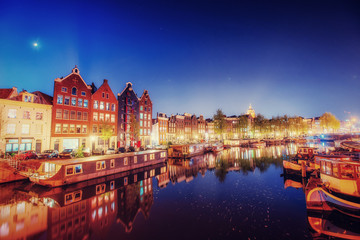 Fototapeta na wymiar Evening city. Highlighting buildings and streets Amsterdam, the 