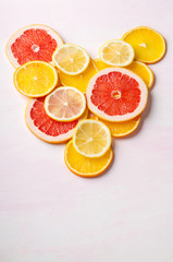 Citrus fruit Heart from slices of lemon, orange, grapefruit on white background. Love, healthy, ecology concept.