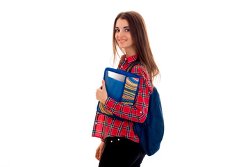 cheerful young student girl with backpack and folder for notebooks looking at the camera and smiling isolated on white background. student years concept. study concept.