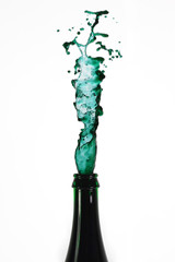 Green wine glass with green water squirt