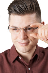 Young Man Trying On New Glasses