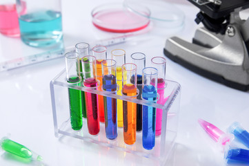 Box full of chemical probes with colorful liquids in laboratory