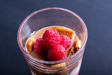 Glass of chocolate and rapsberry dessert