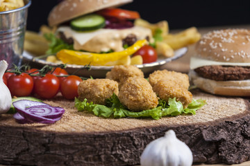 Fresh french fries, chips with tasty burgerand chicken nuggets