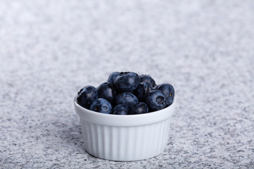 Bowl of fresh juicy huckleberries