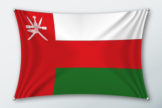Oman national flag. Symbol of the country on a stretched fabric with waves attached with pins. Realistic vector illustration.