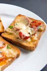 Grilled toast with camembert and cherry tomatoes