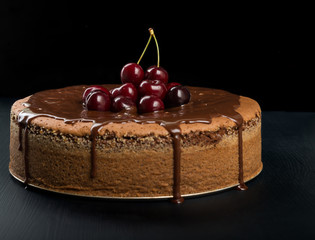 Chocolate cake with juicy cherries