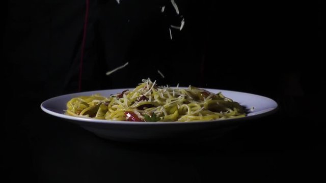 Chef throws parmesan pasta slow motion