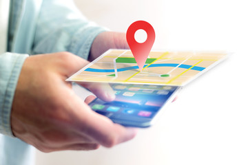 Vuiew of a Concept of geographical localization on a map with a smartphone