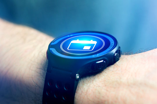 Businessman hand holding smartwatch with car icon - Powered by Adobe
