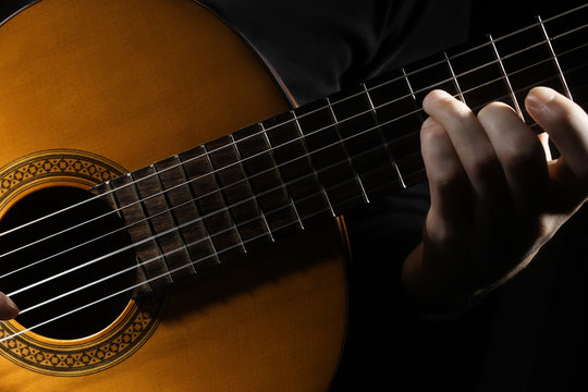 Acoustic guitar player hands Classical guitar close up
