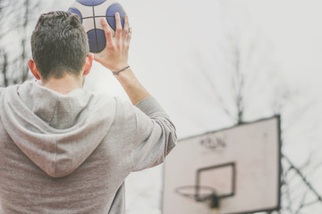 Street basketball player shooting hoops