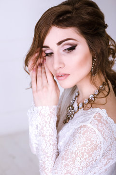 Beauty Portrait of bride wearing in wedding dress with voluminous skirt, studio photo