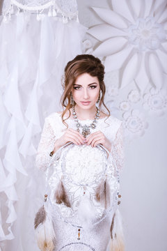 Beauty Portrait of bride wearing in wedding dress with voluminous skirt, studio photo