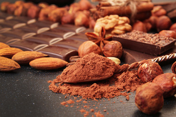Cacao powder dessert spoon, chocolate pieces, almonds,  filbert,