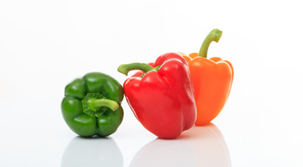 Colorful bell peppers on white background