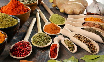 Variety of spices and herbs on kitchen table