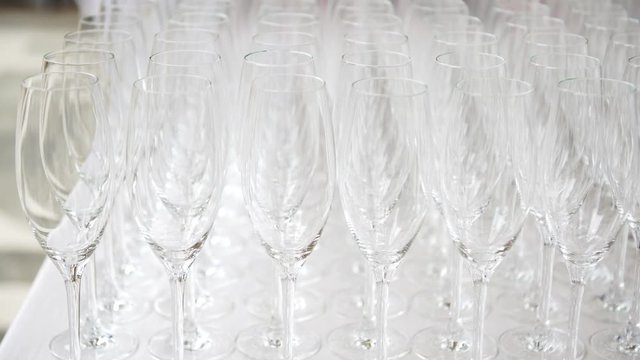 Raws of empty flutes at the wedding catering, 4K