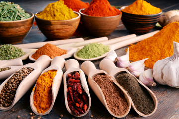 Variety of spices and herbs on kitchen table
