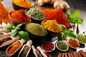 Variety of spices and herbs on kitchen table