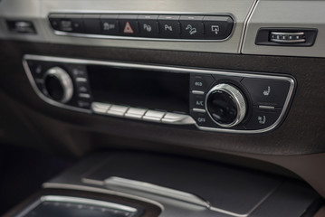 Obraz na płótnie Canvas Modern car dashboard with control buttons. Interior detail.
