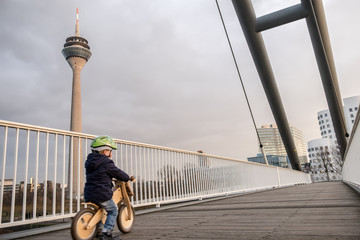 Little boy driving his bike